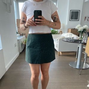 green & black mini skirt